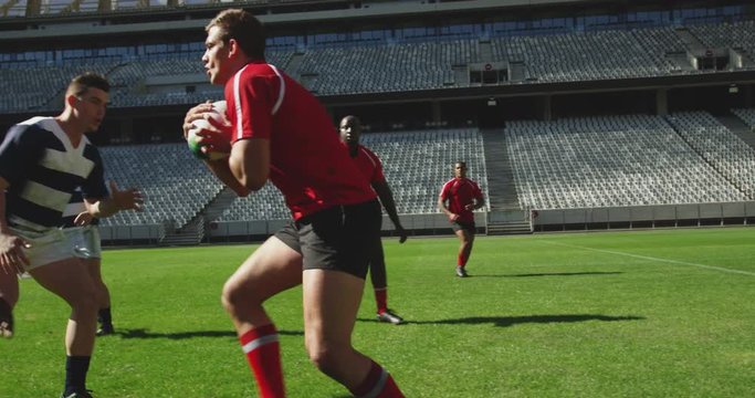 Rugby players playing rugby match in stadium 4k