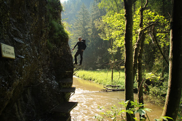 A tourist in the beautiful gorges of the Slovak Paradise National Park