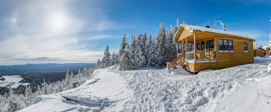 Panoramic view of the wooden cabin at the edge, perfect winter day for a hike, Megantic national park, Quebec, Canada
