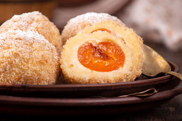 Austrian and czech sweet dessert apricot dumplings. Filled cottage cheese dough.