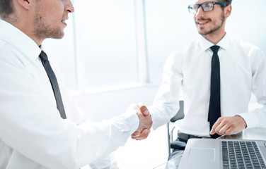 Business handshake. Close-up of business men shaking hands