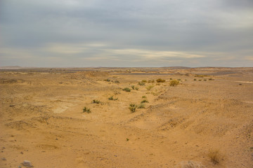 desert sand valley empty simple scenery landscape in cloudy weather time with gray sky and...