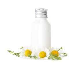 Bottle of cosmetic product with chamomile flowers on white background