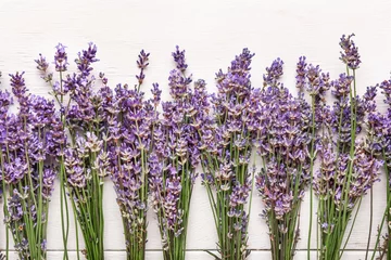 Muurstickers Beautiful lavender flowers on white wooden background © Pixel-Shot