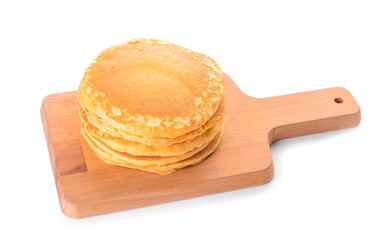 Board with tasty pancakes on white background