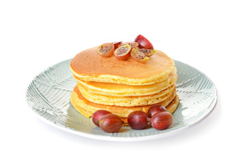 Tasty pancakes with gooseberry on white background