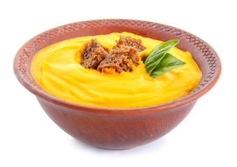 Bowl of tasty cream soup on white background