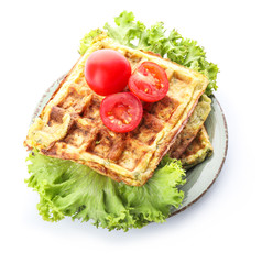 Plate with tasty squash waffles on white background