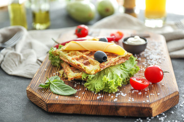 Tasty squash waffles on wooden board