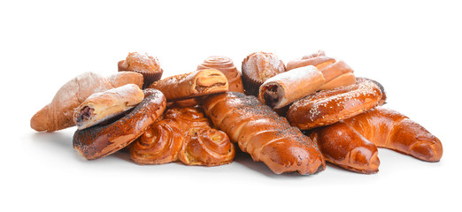 Heap of tasty pastries on white background