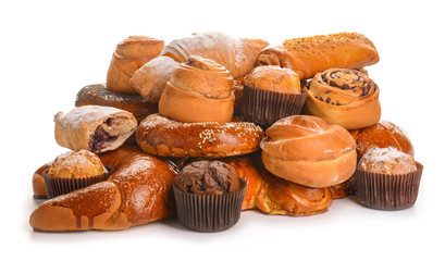 Heap of tasty pastries on white background