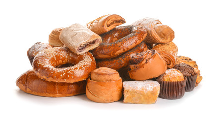 Heap of tasty pastries on white background