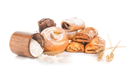 Heap of tasty pastries on white background