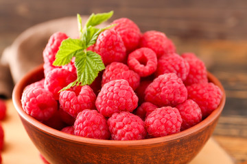 Bowl with fresh raspberries, closeup
