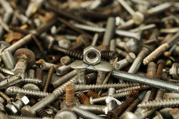 Inside the screw box of my workshop. Between them, in the center, an hexagonal nut.