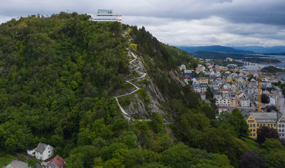 Fototapeta na wymiar viewpoint called Fjellstua Utsiktspunkt or Fjellstua on mount Aksla in Alesund, Norway. Aerial view from drone. July 2019