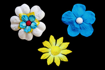 artificial paper flower on black background