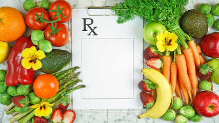 Healthy lifestyle, food is medicine, prescription for good health concept flatlay with colorful fruits and vegetables and clipboard.