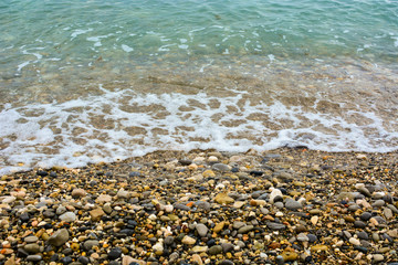 Pebble shore of French Riviera in Nice, natural background