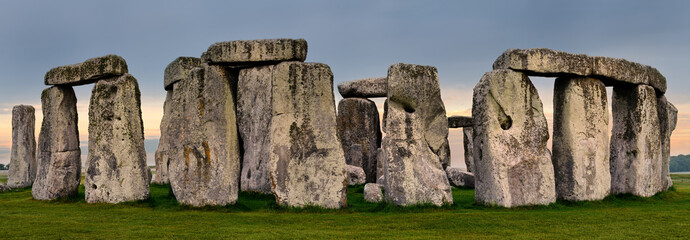 Panorama of Stonehenge prehistoric stone circle ruins in Wiltshire England at first light sunrise