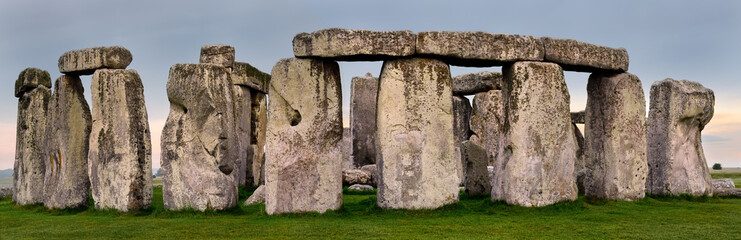 Wide Panorama of Stonehenge prehistoric stone circle ruins amongst farm fields in Wiltshire England...