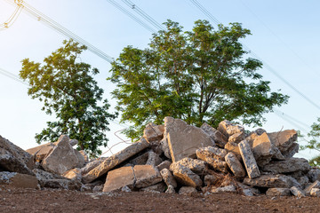 Concrete debris piles with sunlight in the countryside.