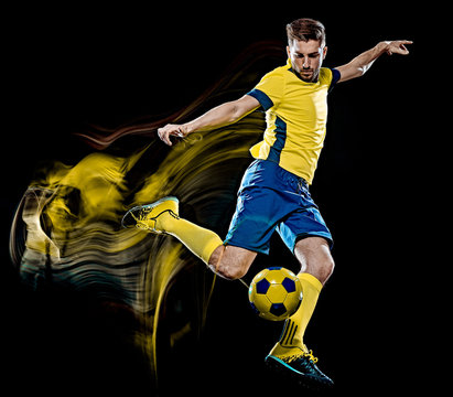 one caucasian soccer player man isolated on black background with light painting speed effect