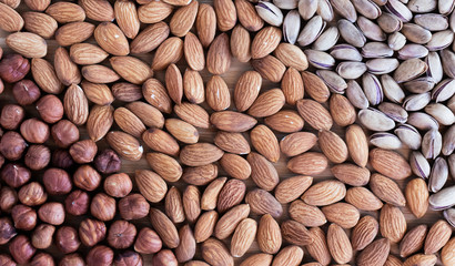 Nuts pistachios, almonds and hazelnuts as a background