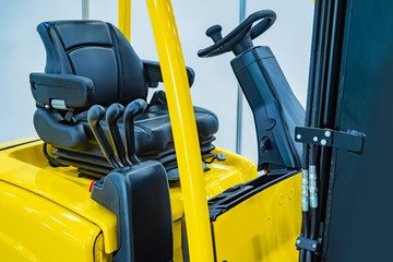 Driver's seat of forklift operator. Forklift in stock. The cabin of the forklift. The control cabin...