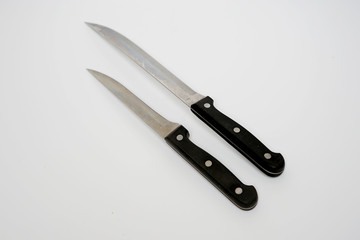 Various kitchen knives with black handle isolated with white background