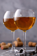 White wine in a glass. The concept of winemaking.Still life on a textural background.