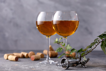 White wine in a glass. The concept of winemaking. Place under your text. Still life on a textural background.