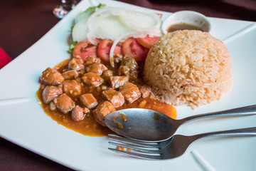 Obraz premium Shot of Beef Lok Lak one of the most popular Cambodia food served on dish. Lok Lak is cooked by stir-fried beef with oyster sauce, ground black pepper and garlic mixed together in high heat.
