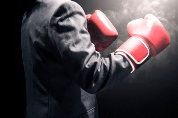 Businessman with red boxing gloves