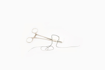 Forceps with curved suture needle isolated white background- Image