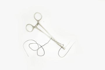 Forceps with curved suture needle isolated white background- Image
