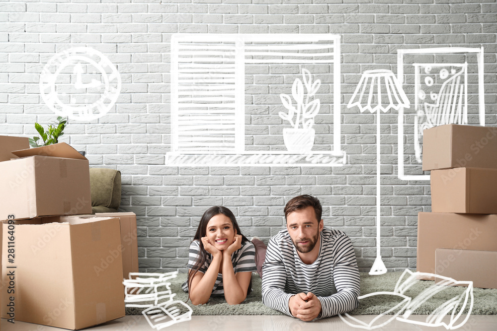 Canvas Prints Happy couple with belongings imagining interior of new house