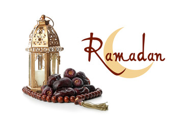 Tasty dates, Muslim lamp and tasbih on white background