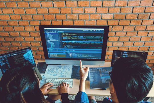 Developing programmer Team Development Website design and coding technologies working in software company office