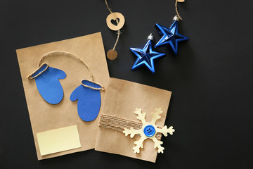 Beautiful Christmas composition with handmade cards on dark background