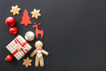 Christmas decor, gift and cookies on dark background