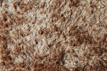 Brown fabric carpet with long pile texture