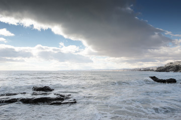 breaking waves on a stony beach
