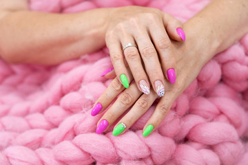 lots of color gloss manicure hands has different blotches