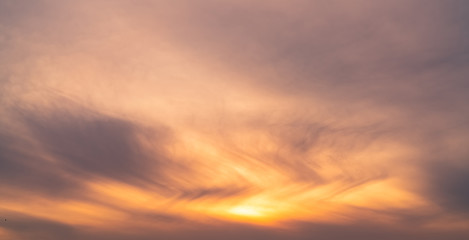 Beautiful sunrise sky. Orange, grey, and white sky. Colorful sunrise. Art picture of sky at sunrise. Sunrise and clouds for inspiration background. Nature background. Peaceful and tranquil concept.