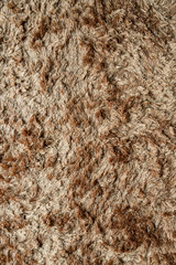 Brown fabric carpet with long pile texture