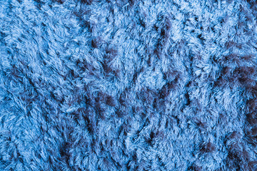 Blue fabric carpet with long pile texture