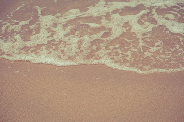 Beach sand and ocean waves