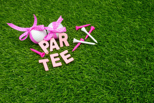 Golf Ball With Pink Ribbon Are On Green Grass For Party Invitation 