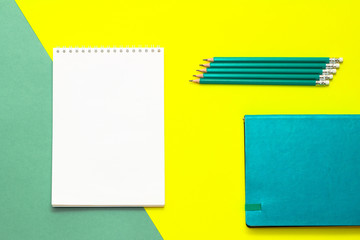 White notepad and pencils